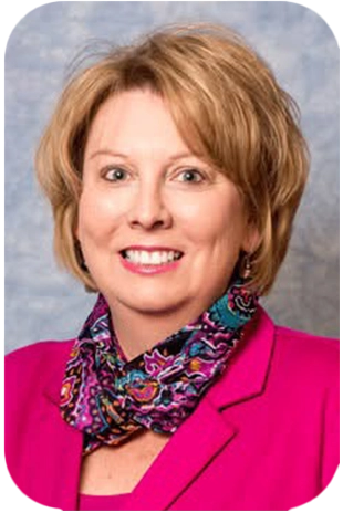 Julie-Kilgore-300px a professional headshot of julie kilgore wearing a pink jacket and scarf - smiling at the camera